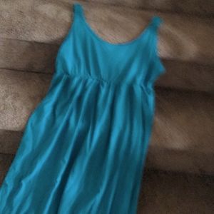 New sleeveless cotton turquoise dress. No tags but item is new.